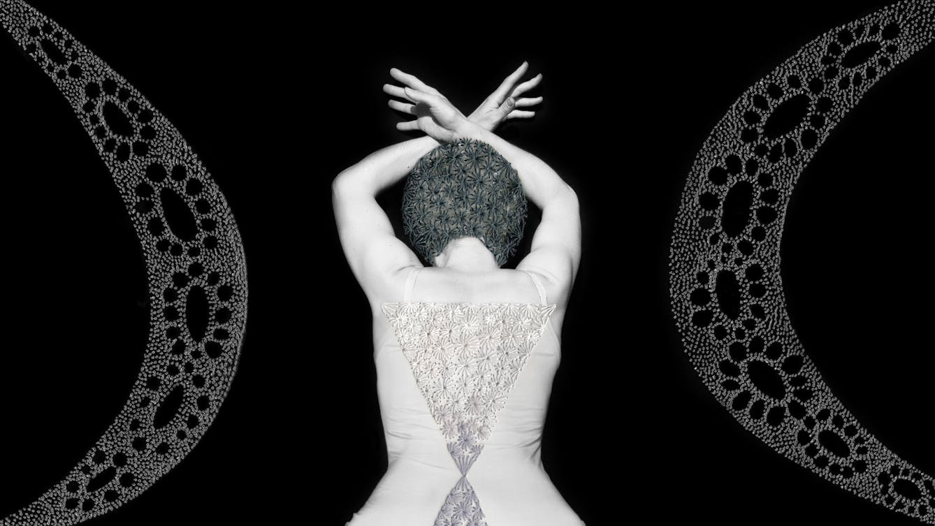 Artwork made up of a black and white photograph of a female figure from behind, from the waist up, against a black background. Her arms are held above her head and her wrists cross, fingers extended. Embroidered into the photographic print with grey thread is a crisscross floral pattern which exactly covers her head and hair. Across her back, embroidered in silver thread is a large triangle connected to a smaller triangle. Either side of the figure are two large curved forms made up of a layered texture of dots.