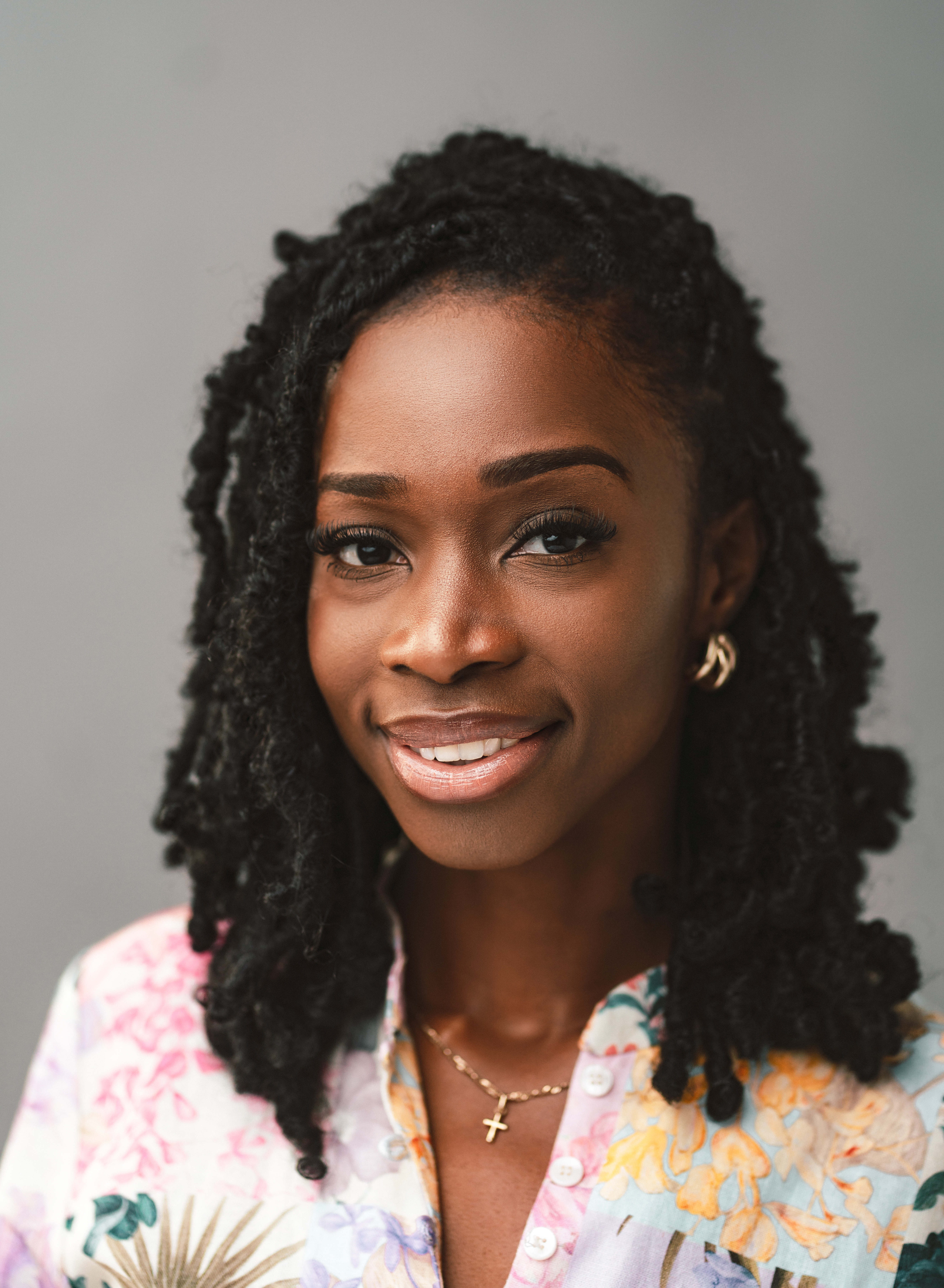 A headshot of Joelle, who is smiling into the camera 