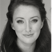 Black and white headshot of Caroline