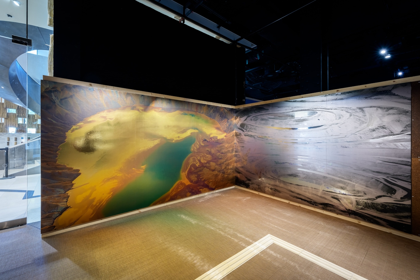 Two large works of otherworldy waterscapes spanning an entire wall.