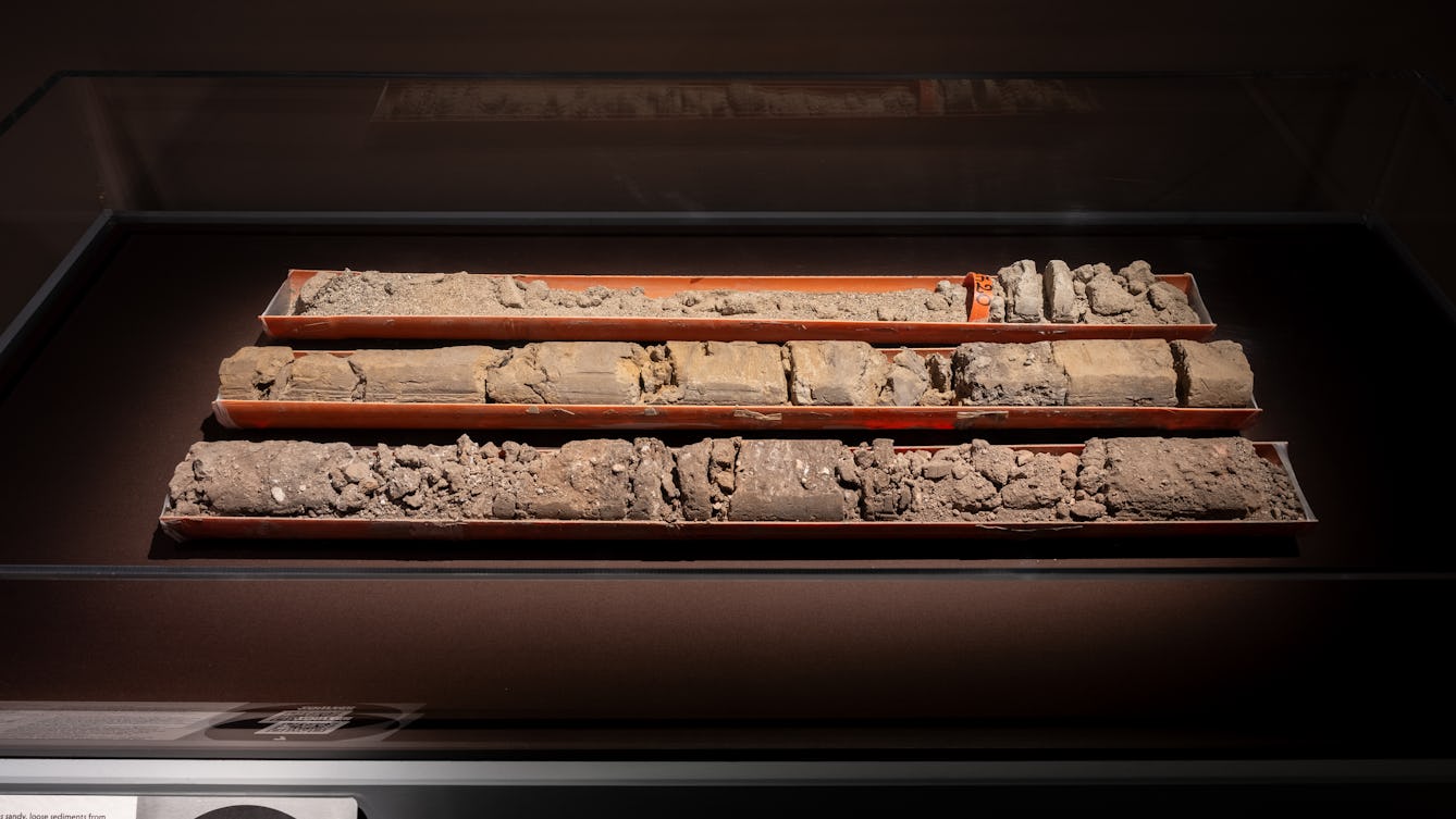 Photo of three columns of soil. The column the farthest away from the camera is the oldest and most degraded.