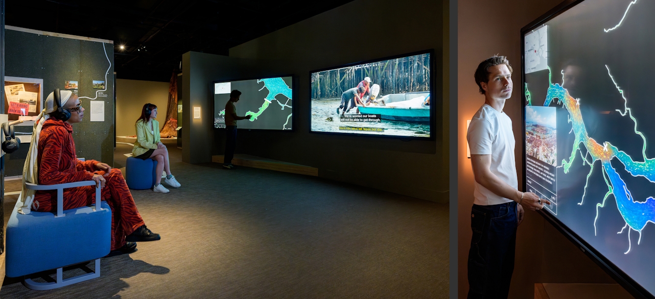 Photographic diptych showing on the left two gallery visitors watching a film on a large screen, wearing headphone and on the right a close-up of a visitor interacting with a large touch screen.