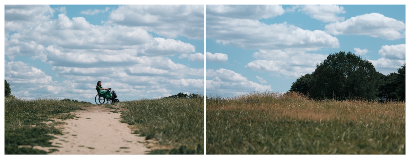 Diptych creating a panorama of a parkland scene in which a worn out path leads up to a horizon line where the silhouette of a woman seated in a wheelchair with an electric hand cycle, breaks into the blue, cloud speckled sky.