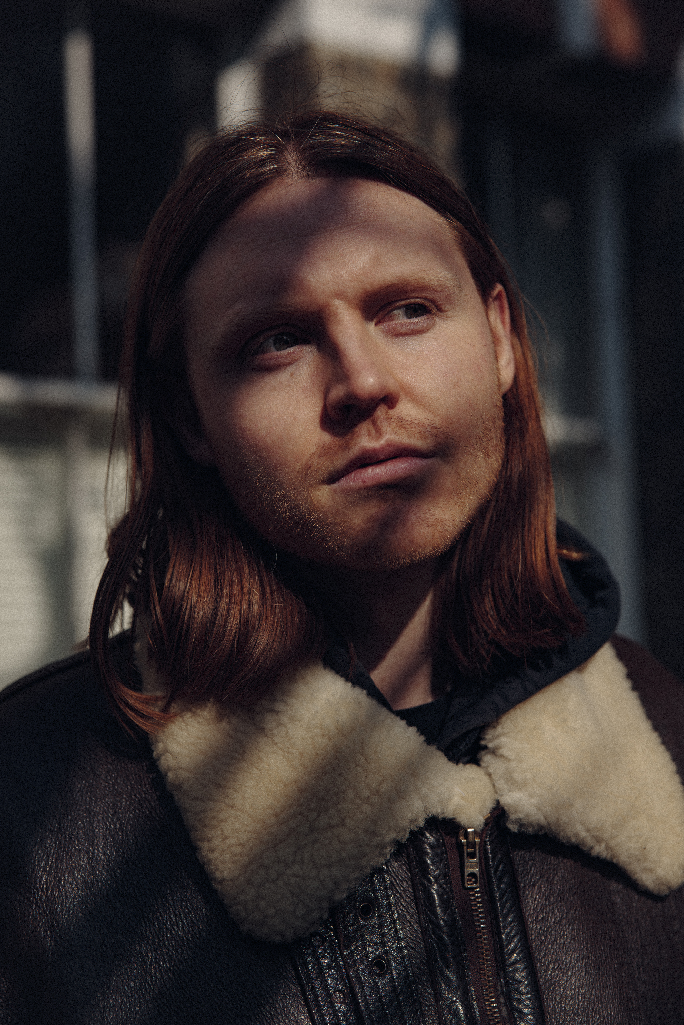 A black and white photograph of the head and shoulders of Lewis Khan.