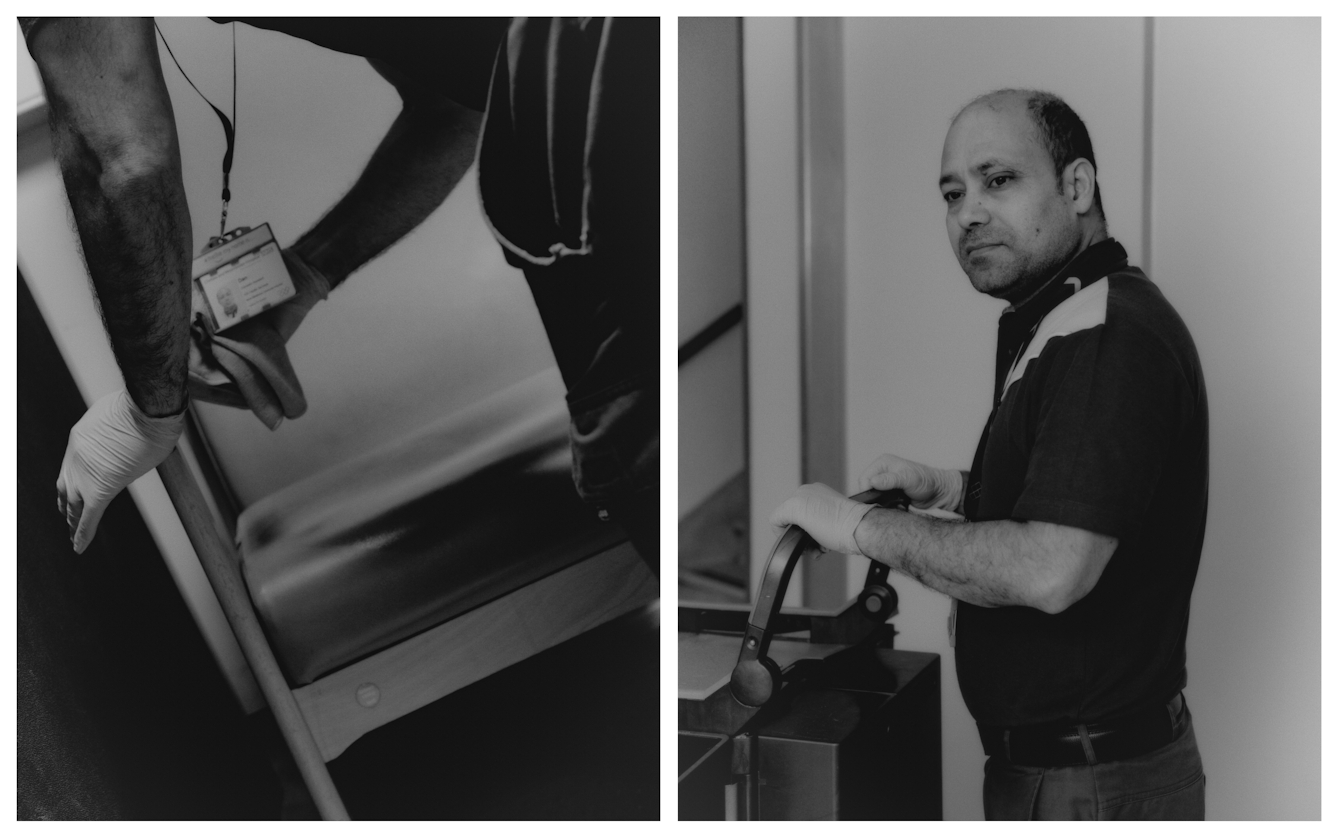 Black and white photographic diptych of a man cleaning areas of a hospital at night. On the left he wipes the arm of a chair with a cloth, on the right he is pushing a trolley, glancing off to his left.