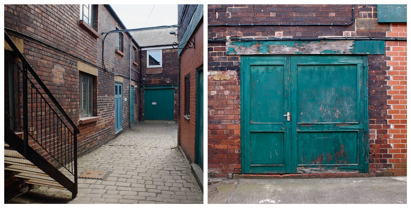 Photographic diptych showing two views of a red brick industrial factory building complete with large wooden doors covered in flacking green paint and a black cast iron fire escape stairs descending onto a cobbled alleyway.