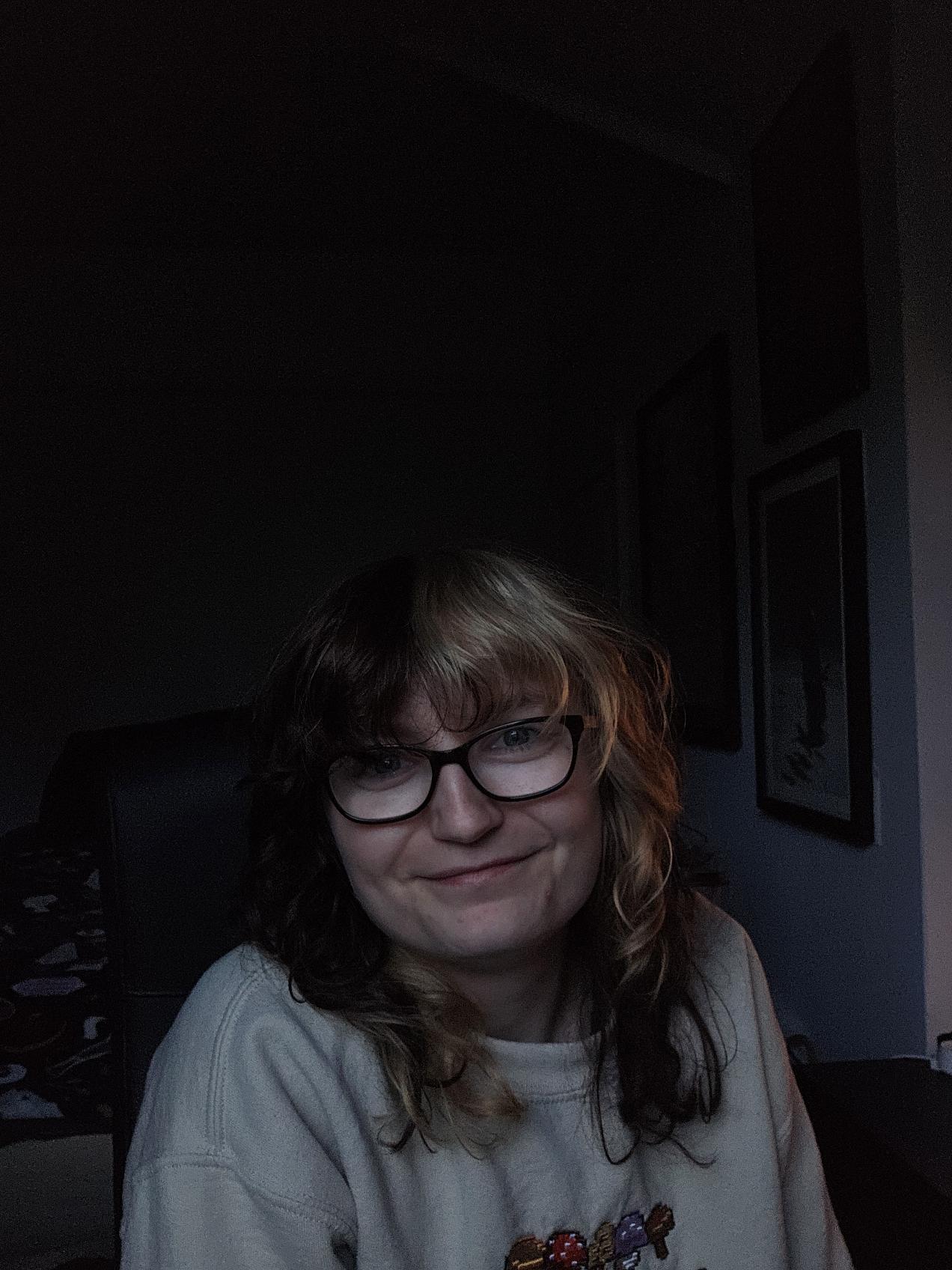 A headshot of Océane, who is staring into the camera and smiling.