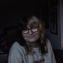 A headshot of Océane, who is staring into the camera and smiling.