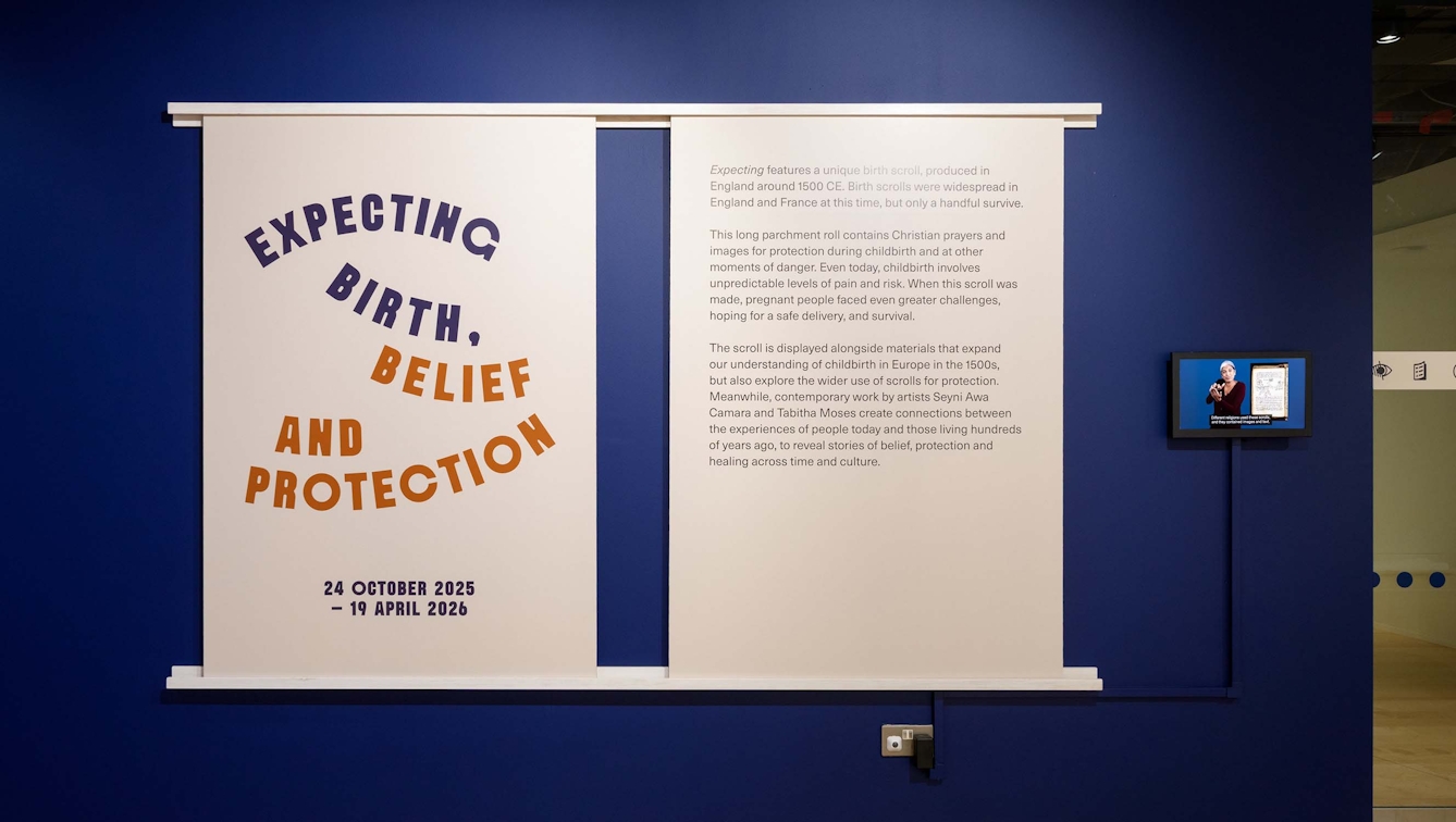 Introductory wall display outside the exhibition 'Expecting: Birth, Belief and Protection' at Wellcome Collection.