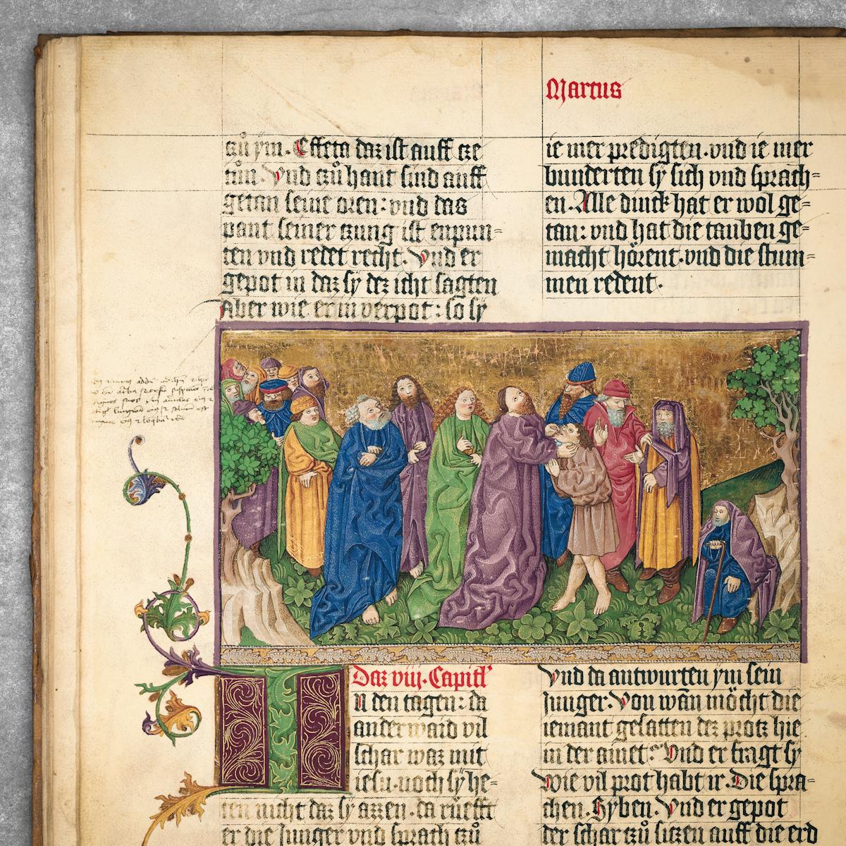 A page from the Ottheinrich Bible, 1425-30. The richly coloured illustration with gold background shows Christ "healing a deaf-mute" man.