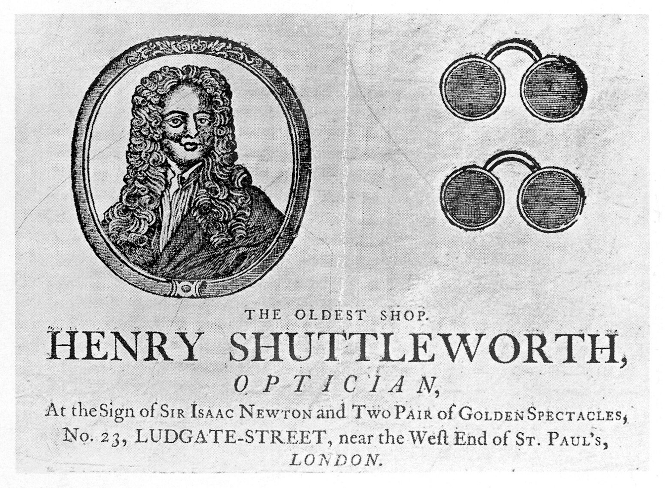 Copy of an 18th century tradecard for Henry Shuttleworth, optician showing a portrait of Isaac Newton on the left and two wire framed glasses with round lenses on the left. The text at the bottom says: "Henry Shuttleworth, optician : at the sign of Sir Isaac Newton and two pair of golden spectacles, no. 23, Ludgate-Street, near the west end of St. Paul's, London / Henry Shuttleworth."