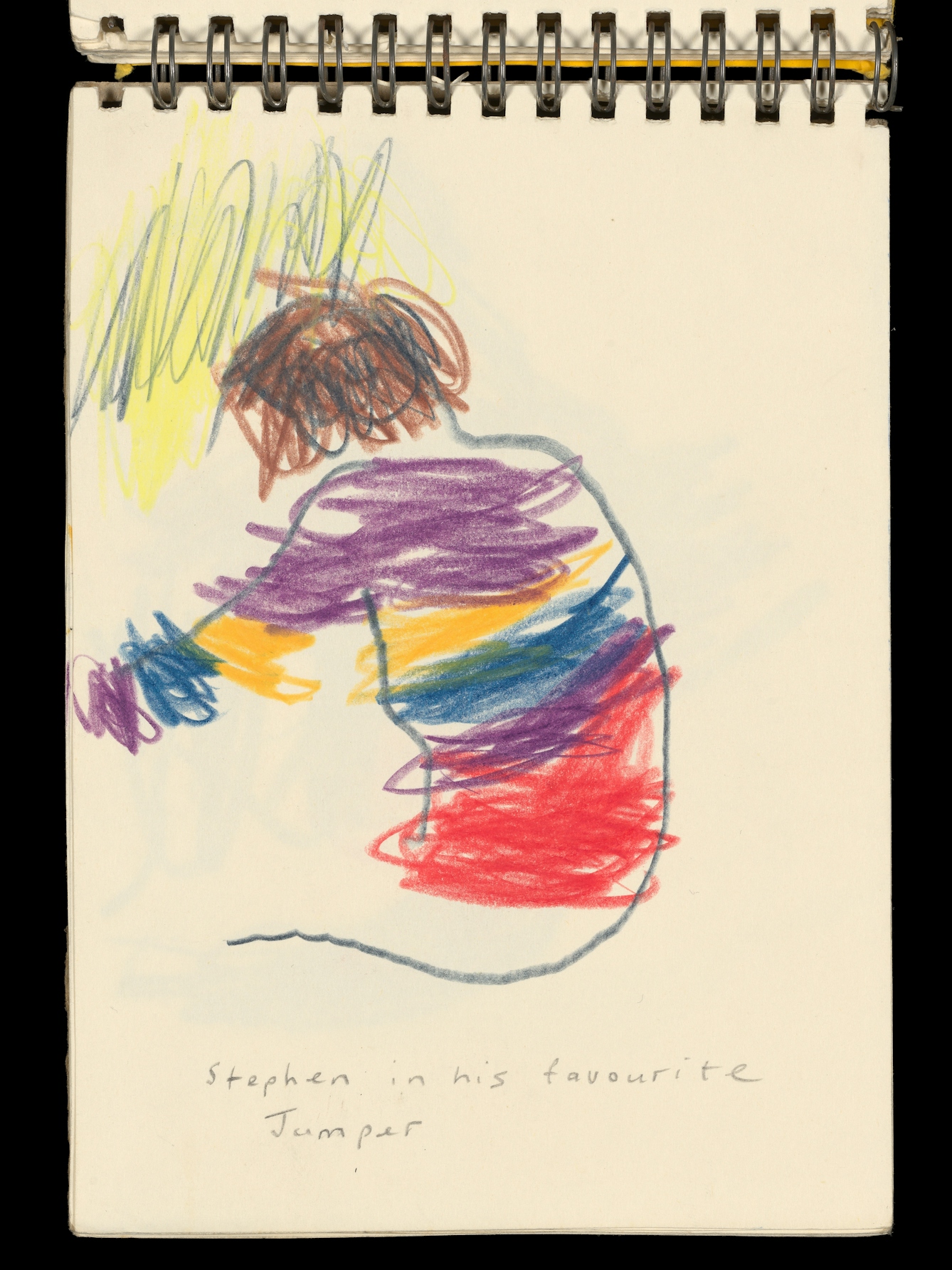 Photograph of an open page from a small sketchbook. Not eh page is a pencil drawing of the back of a small boy seemingly seated and engaged in an activity. Hi jumper is brightly striped with purple, red yellow and blue. Under the sketch are the words, "Stephen in his favourite Jumper".