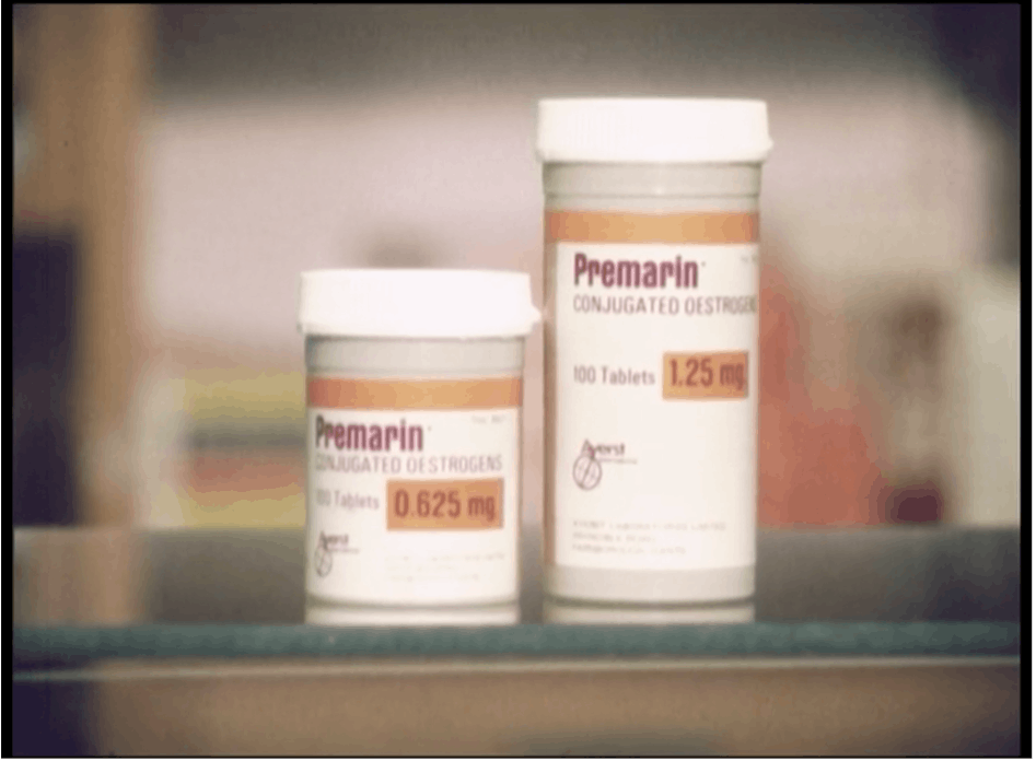Film still featuring two bottles of pills, with the label: 'Premarin: Conjugated Oestrogens/ 100 Tablets, 1.25 mg'