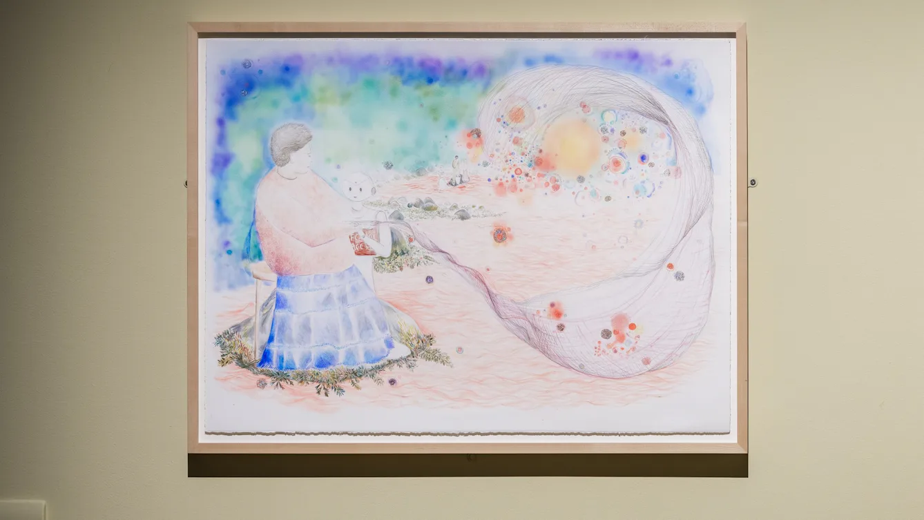 Framed pastel artwork of a seated figure holding a swirling, colourful, translucent fabric against a surreal background.