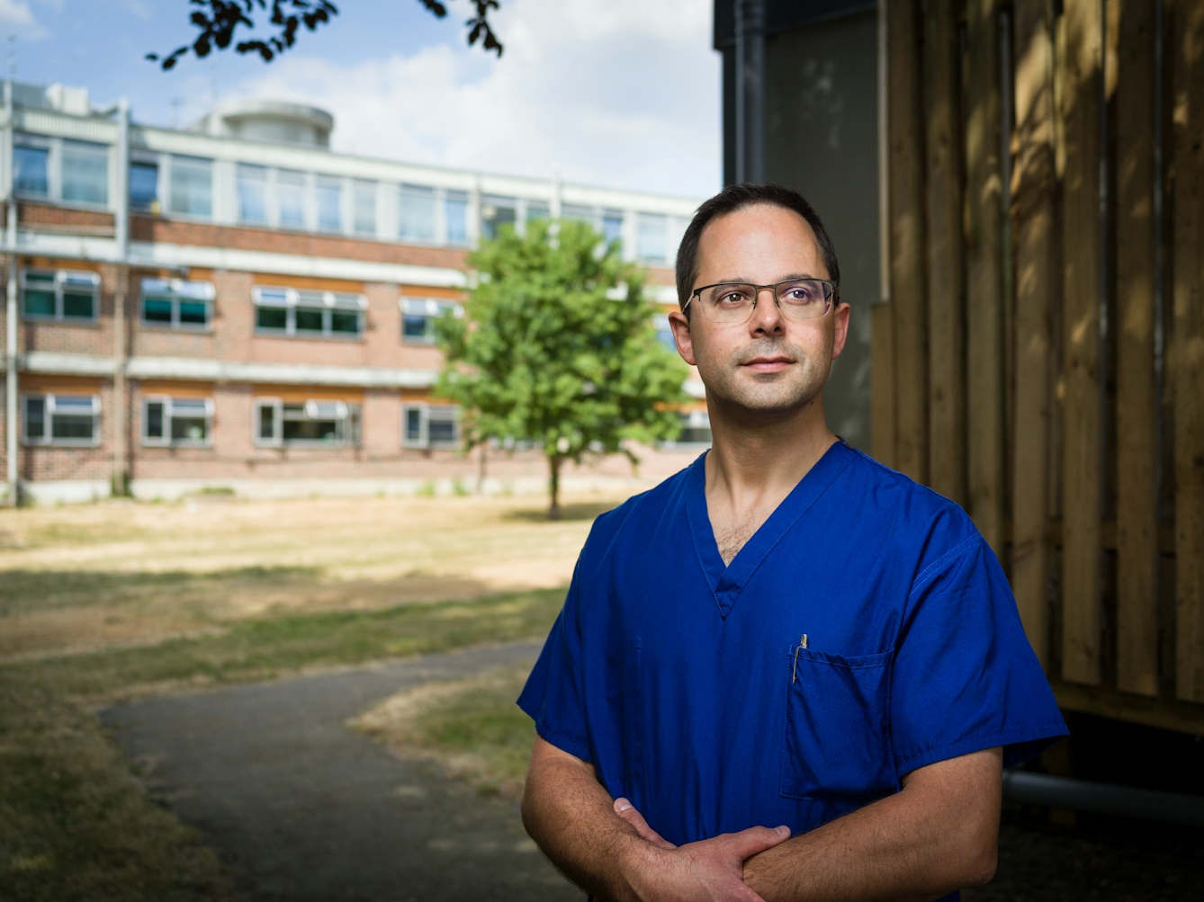 Photographic portrait of consultant anaesthetist, Ben Silverman outside Harefield Hospital.