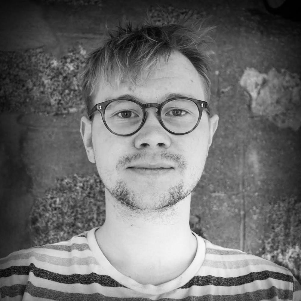 Photographic, black and white, head and shoulders portrait of Ruaridh Lever-Hogg.