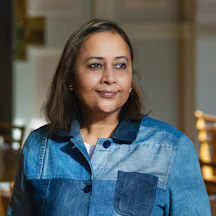 Photo of Pragya Agarwal in a denim shirt.