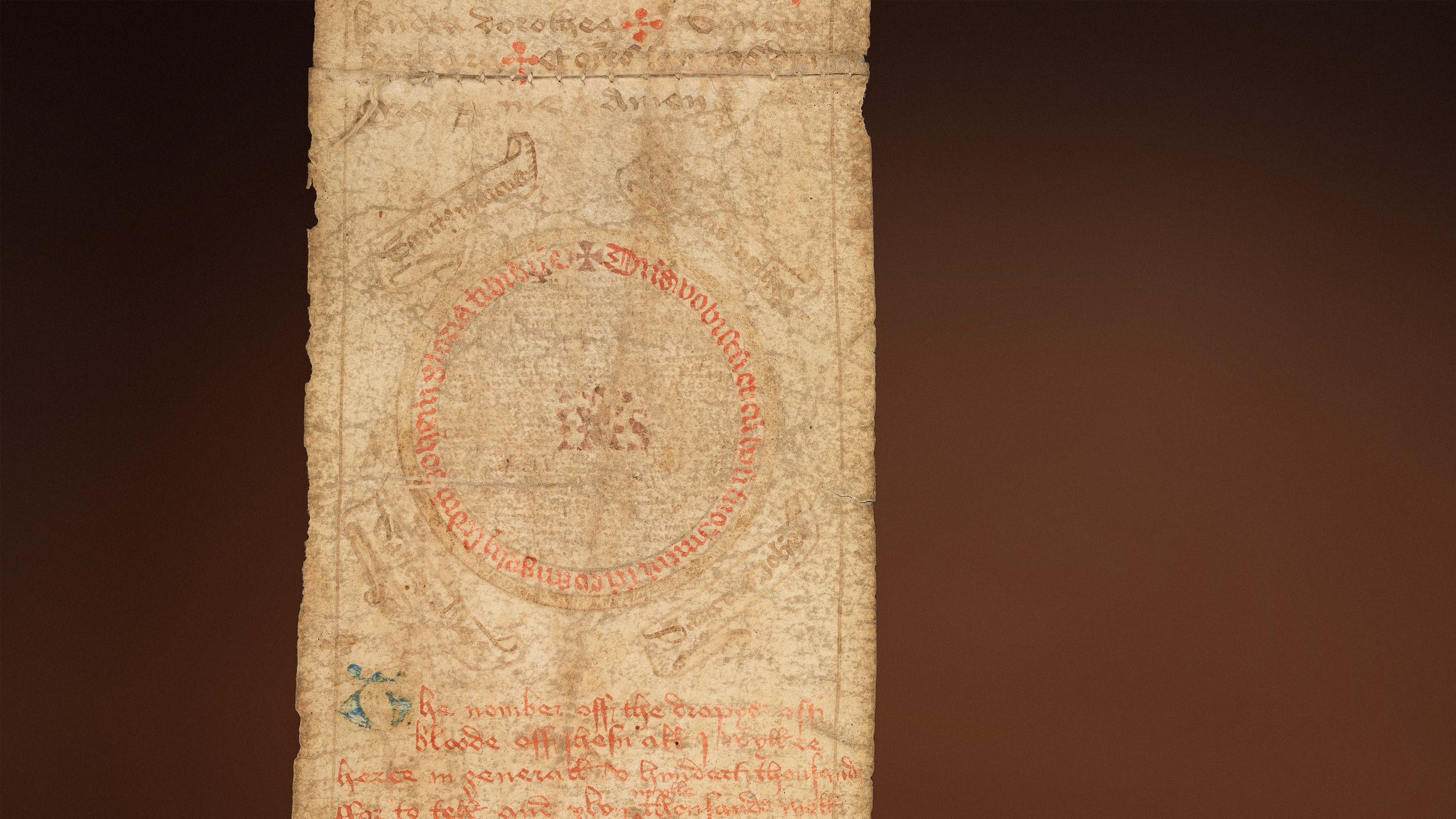 Section of an unrolled medieval birth scroll showing signs of heavy wear, text rubbed feint and illustrations.