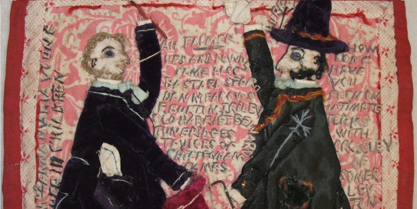 Colour photograph showing the embroidery of Lorina Bulwer. There are two figures dressed in black who appear to be holding sticks and either greeting or fighting one another. In the background are words stitched in capital letters, including "ups and downs" and "bastard" along with various names.