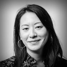 Photographic black and white, head and shoulders portrait of Deanna Fei.