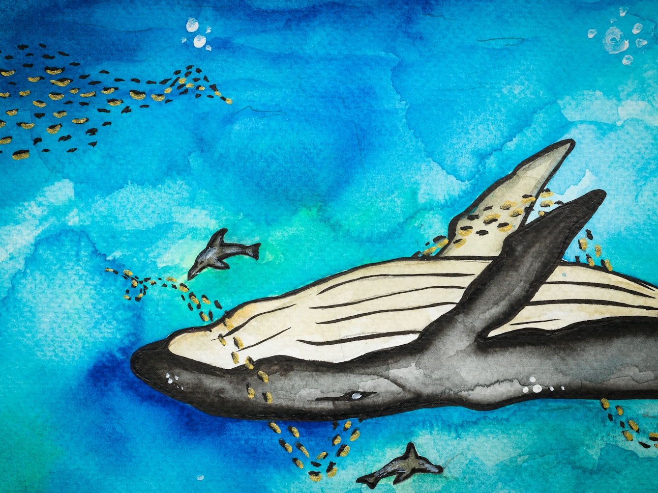 Detail from a larger colourful watercolour artwork. The artwork shows an underwater scene with a whale in the centre. A shoal of small fish are swimming around the whale. There is another shoal of small fish to the left of the whale. 