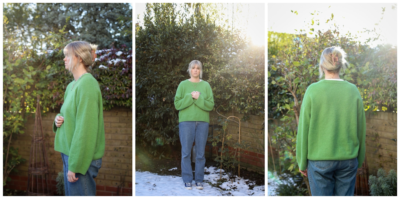 Photographic triptych. Each image shows the same young woman dressed in blue jeans and a green jumper, standing in an urban back garden. The scene shows a sandstone brick wall, green leaved shrubs and in the central image, snow can be seen on the ground. In the image on the left the woman is in profile facing left, pictured from the thigh up. In the central image she is turned to the camera, pictured in full length with her hands clasped to her chest. In the final image to the right, she has her back to camera and again is pictured from he thigh up.
