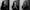 Photographic triptych made up of 3 black and white portraits. The images are square and have a small border between them. Each image shows the same young woman seated in the same position, pictured from the waist up. She seems to be watching something off to camera right. In each image her expression and body language changes from mouth wide open in shock in one to clasping her hands to her face in others. In all of them she seems uneasy and uncomfortable with whatever she is listing to or watching.