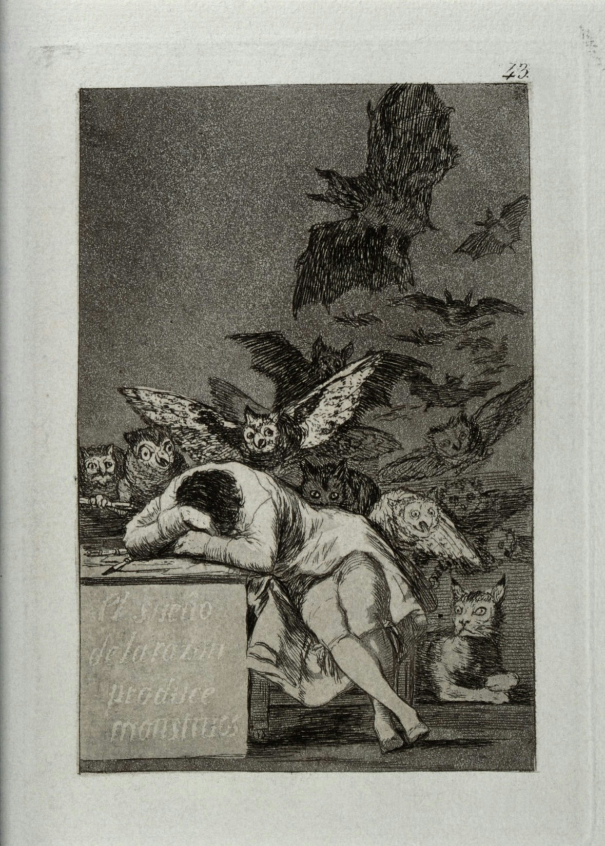 Black and white image of a seated man with his head in his arms, resting on a table. Owls and bats swarm behind him.