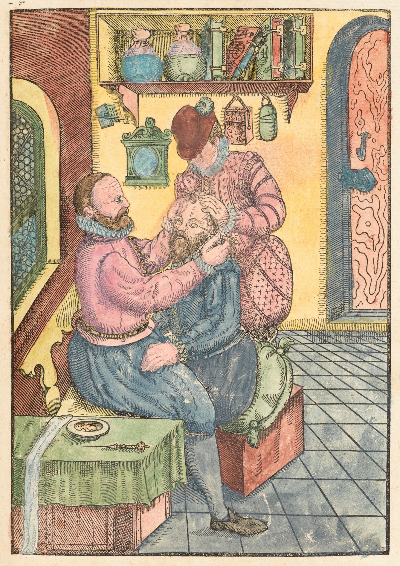 Coloured engraving in a 16th century manuscript showing a seated man having an eye operation. A man in front of him uses an piece of apparatus on the left eye of the seated man, whilst a man behind him holds his head still with his hands.