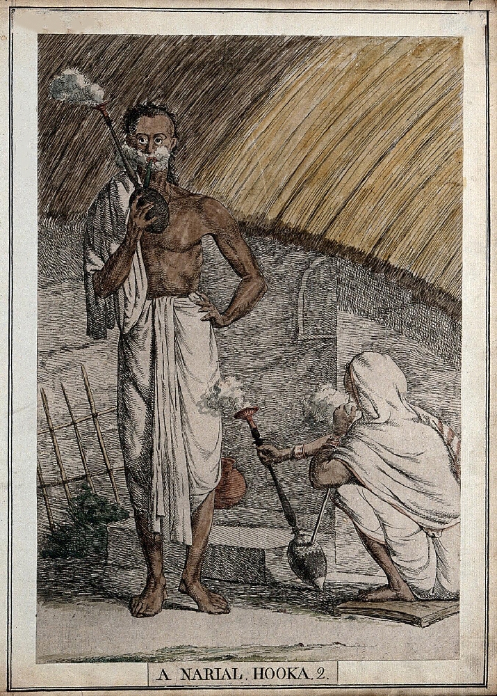 Two Bengali men, one squatting, one standing both smoking coconut hookahs outside a village house