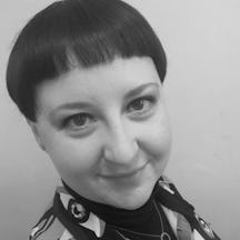 Black and white headshot of Wellcome Collections Development Manager Mel Grant, a smiling white woman with short dark hair.