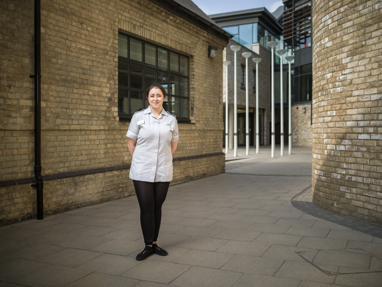 Photographic full length portrait of Jenny Jones, a student nurse, at Anglia Ruskin University, Cambridge.