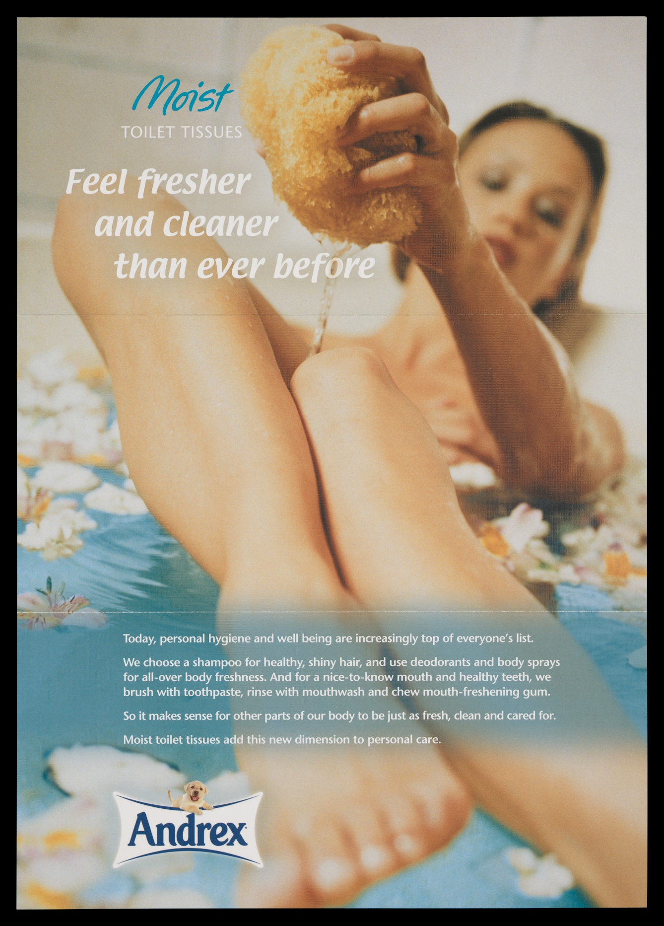 Photograph of the cover of a promotional leaflet for Andrex toilet tissue showing a woman in the bath squeezing water from a sponge over her legs, with the title, "Feel fresh and cleaner than ever before".