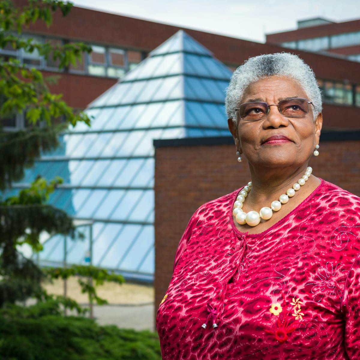 Photographic portrait of Cecilia Brown outside St George's University Hospital, London.