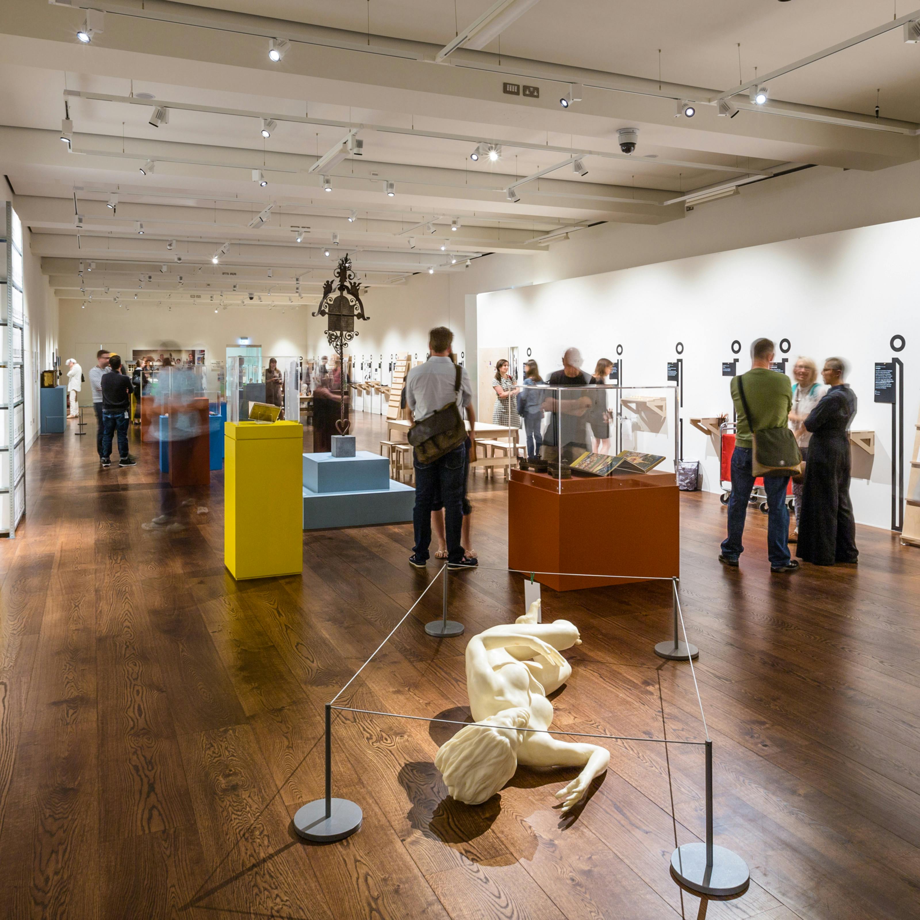 Photograph of the exhibition, An Idiosyncratic A to Z of the Human Condition, showing visitors exploring the space.