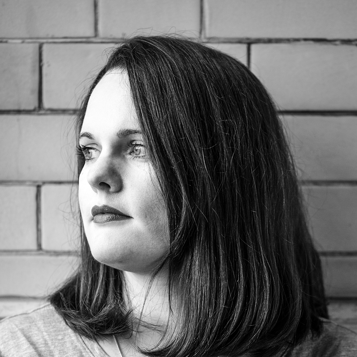 Head and shoulders, black and white portrait of Laura Humphreys.