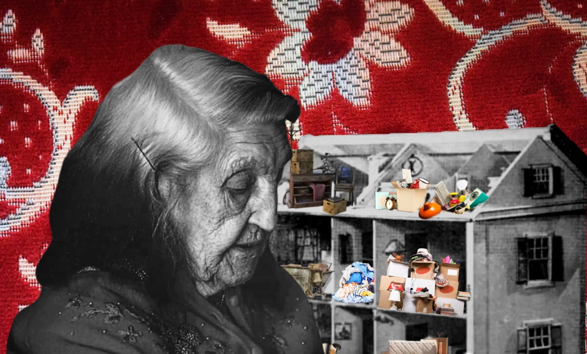 Colourful digital collage. In the foreground is a black and white photograph cut-out of an elderly woman looking downwards. A bobby pin pulls back the grey hair around her right ear. She is wearing a flowery embroidered shawl. Behind the elderly woman and within her eye line is a black and white cut out of a three story toy dollhouse. The walls and roof of one side of the dollhouse have been removed, exposing the interior of the house. Inside the dollhouse in the different rooms there are many small, colourful cut outs of household objects and furniture, including an alarm clock, wooden chests of drawers, filled cardboard boxes, piles of books and bed sheets. The objects are stacked on top of each other messily, forming many piles. The background is a photograph of a red and white floral print. 