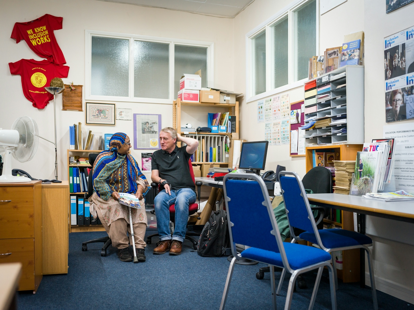 Photograph of Sarifa Patel talking with another Trustee of the charity, ALLFIE.