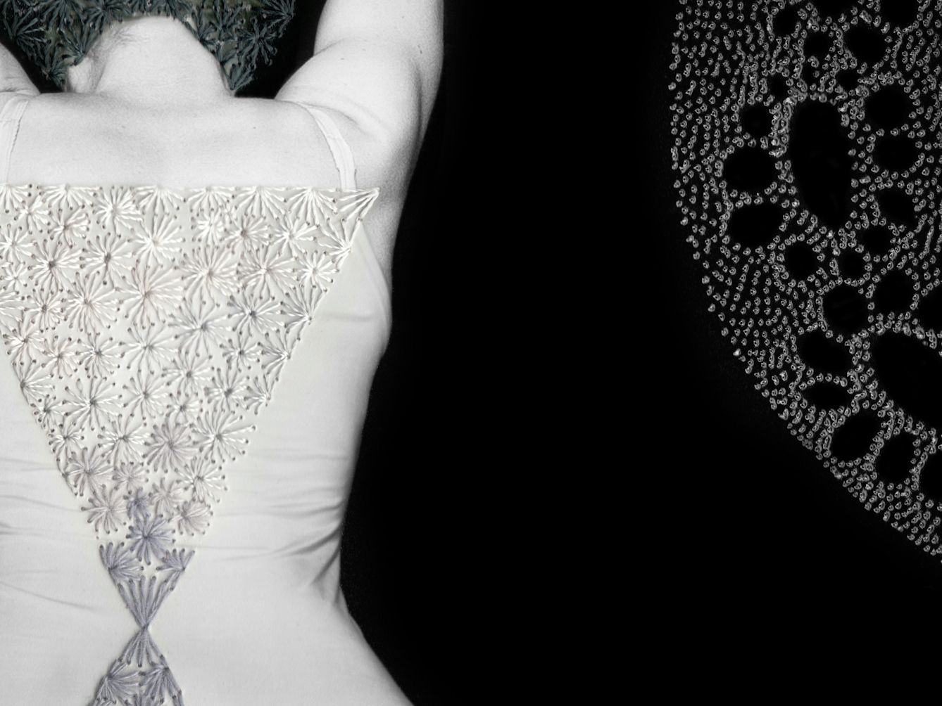 Artwork made up of a black and white photograph of a female figure from behind, from the waist up, against a black background. Embroidered into the photographic print with grey thread is a crisscross floral pattern which exactly covers her head and hair. Across her back, embroidered in silver thread is a large triangle connected to a smaller triangle. To the right of the figure is a large curved form made up of a layered texture of dots.