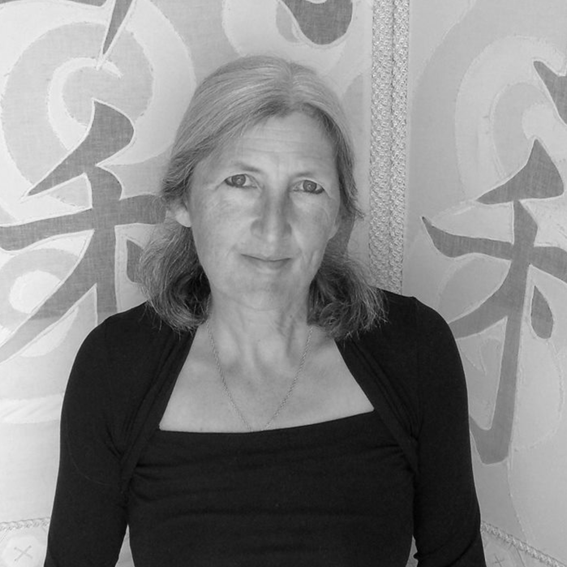 Black and white headshot of Jacqui Carey