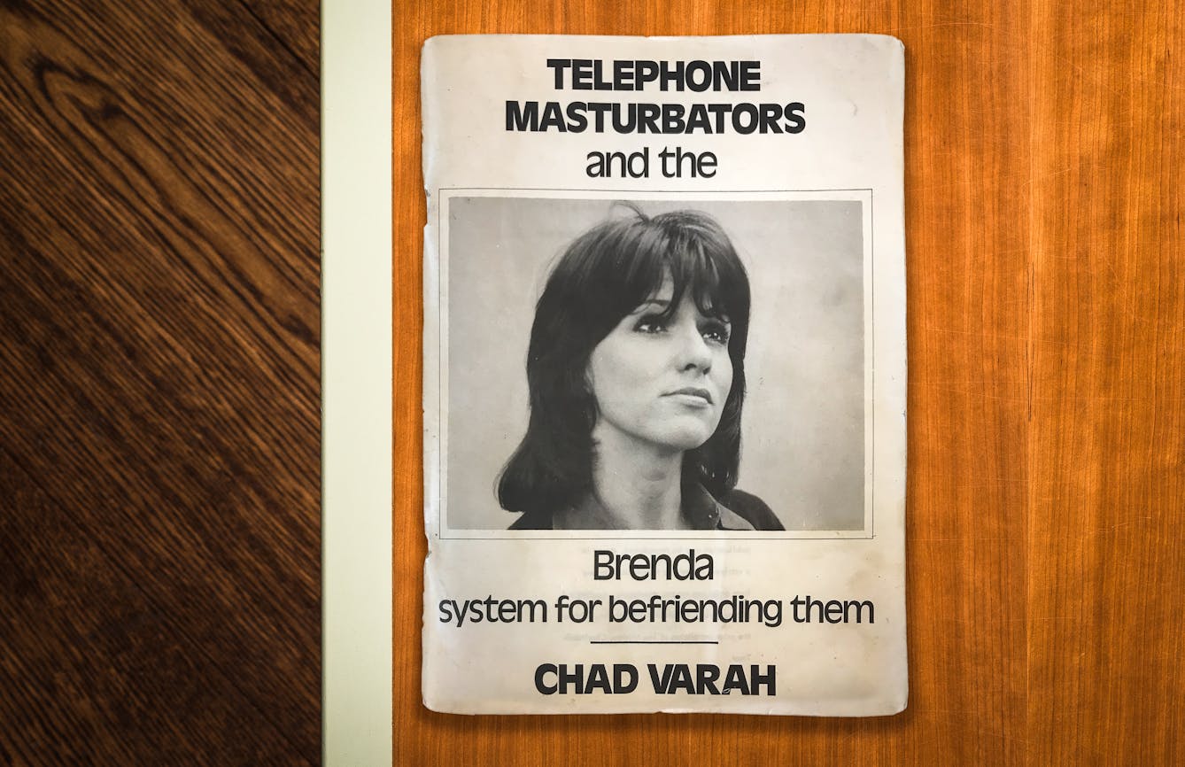 Photograph of the cover of a booklet titled, 'Telephone Masturbators and the Brenda system for befriending them - Chad Varah', lying on a wooden tabletop. On the cover is a blacka nd white photograph of a woman's face looking off into the distance, camera right.
