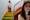 A photograph of Emily Bashforth standing on a colourful staircase in front of a white painted wall. She is looking down at her phone.
She is wearing a cream jumper, orange plaid skirt, black boots and red lipstick. She has long wavy brown hair.
To the right of the photo, there is a close up image of Emily looking at her phone which is superimposed onto the main image.