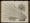 A photograph of a book opened onto a black and white engraving of a plant, which fills the entire double-page spread.