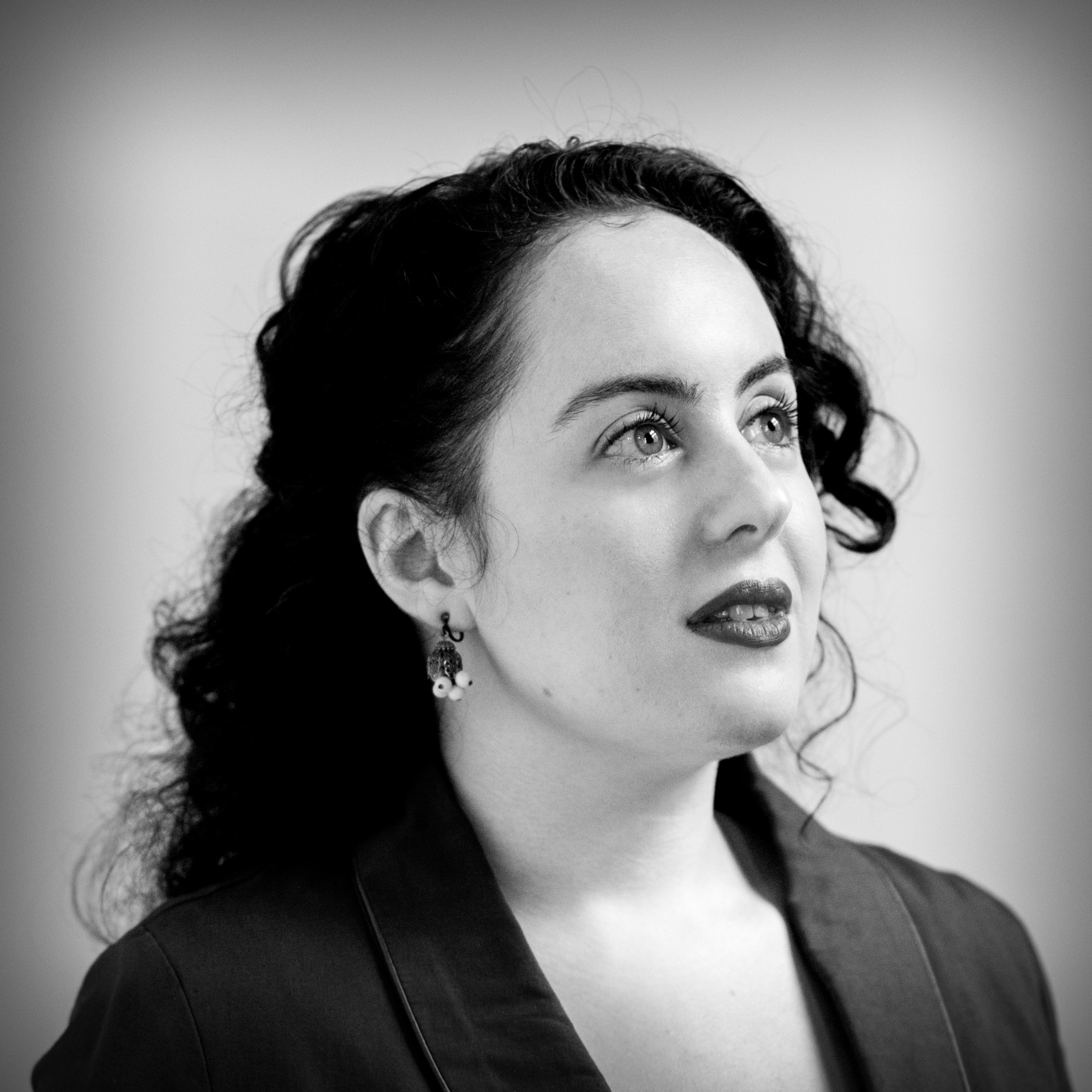 Photographic, black and white, head and shoulders portrait of Natasha Lipman.