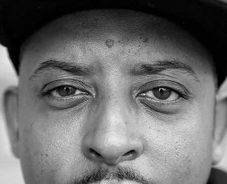 Black and white headshot of Christopher Samuel