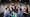 Photograph of ten of the RawMinds Improv Comedy youth group surrounding and looking at science comedian, Simon Watt who is centre frame.