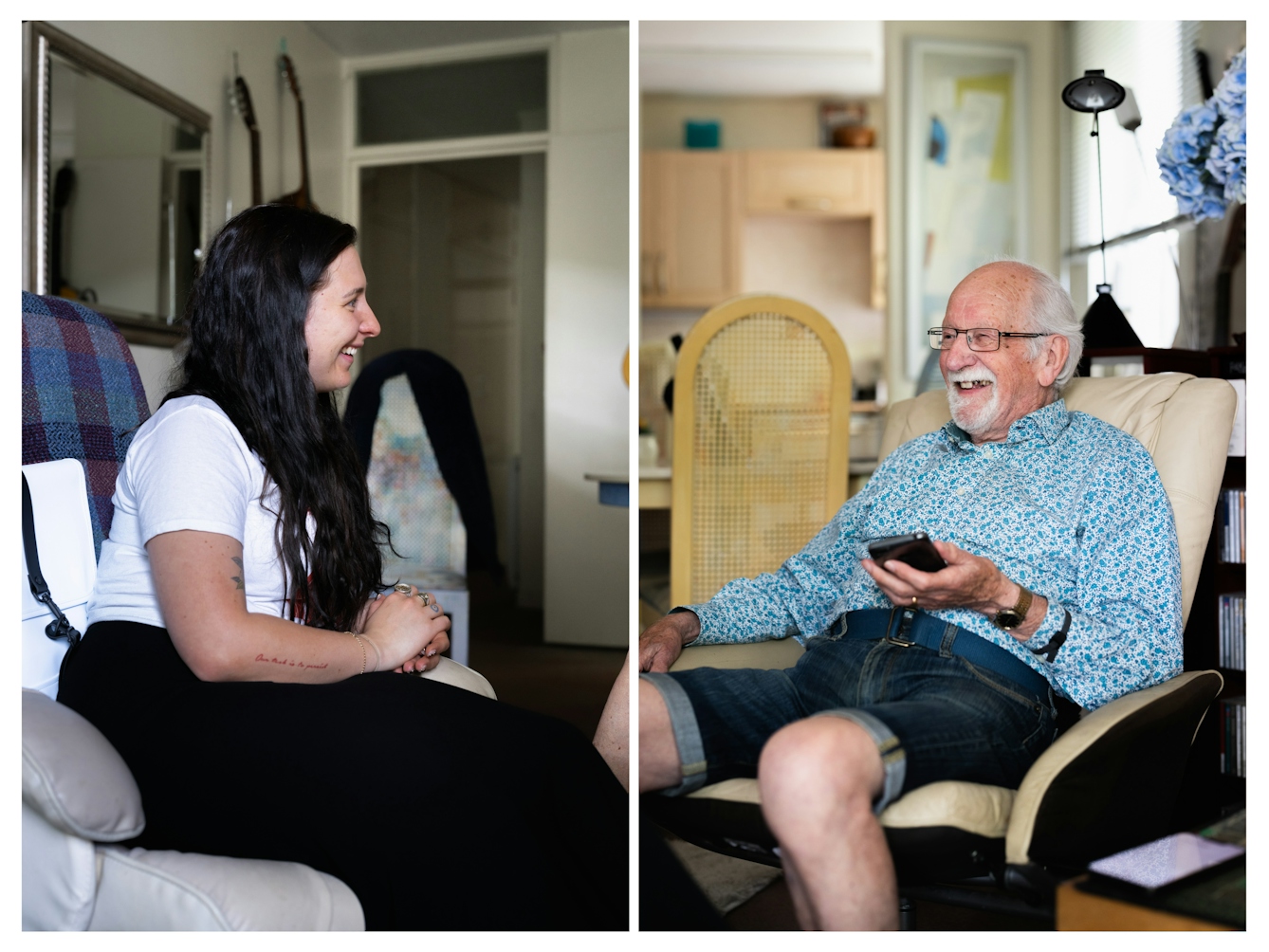 Two photographs next to each other forming a diptych of two people in a living room, sat on armchairs they are facing each and smiling. On the left is a young woman with long dark hair. She is wearing a white t-shirt and a long dark skirt. On the right is an elderly man wearing glasses with white hair and a white goatee beard. The man is holding a mobile phone.
