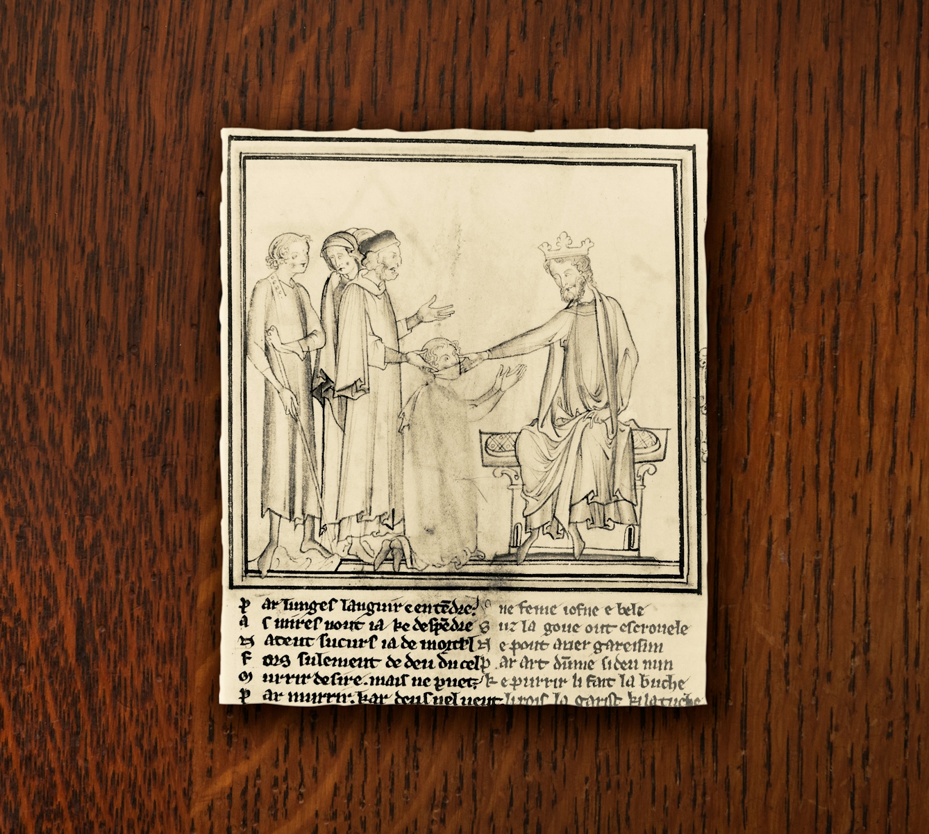 A photograph of an illustration depicting King Edward the Confessor touching the head of a diseased man. The man is kneeling down before the king, his mouth covered with cloth.