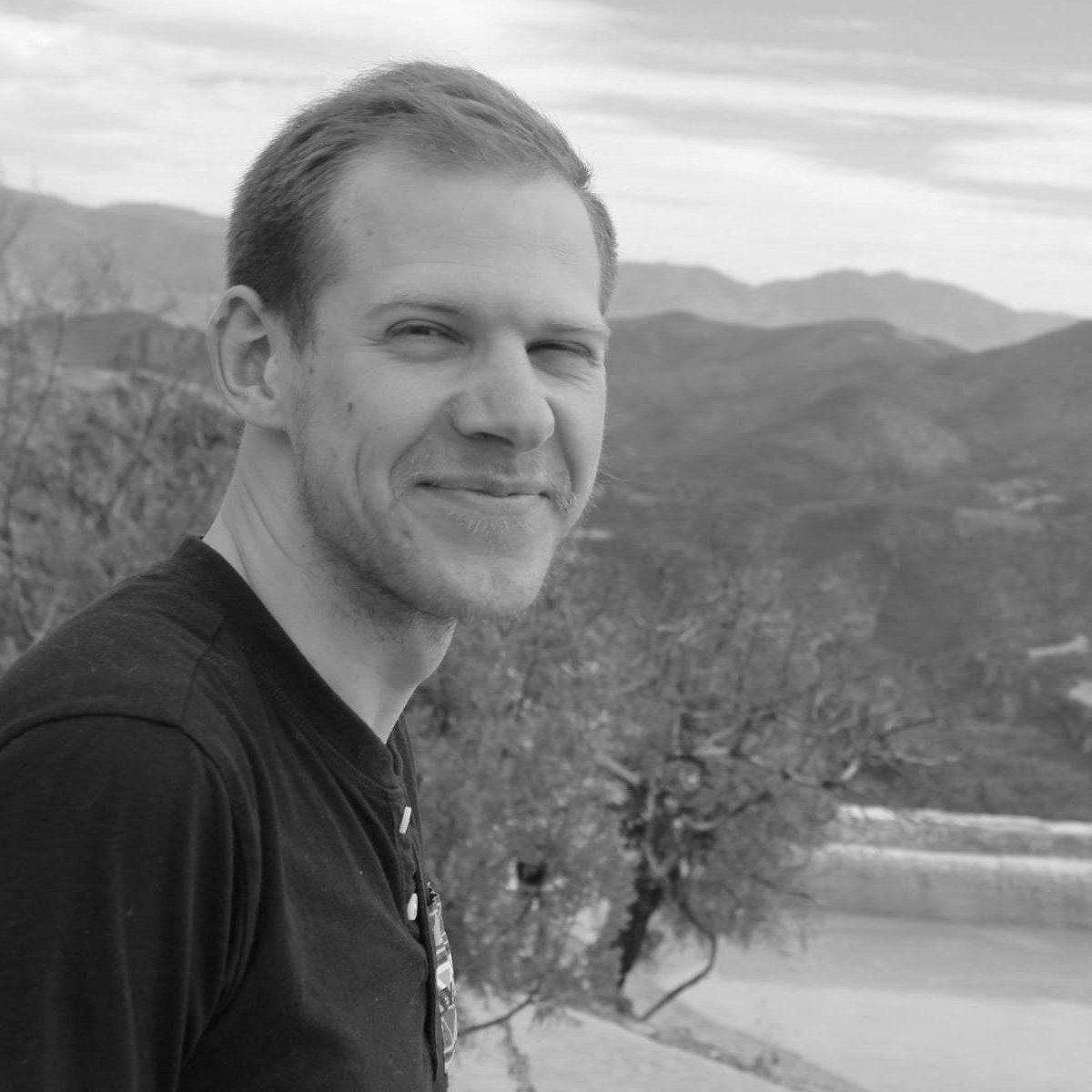 Black and white photograph of Christopher Decou
