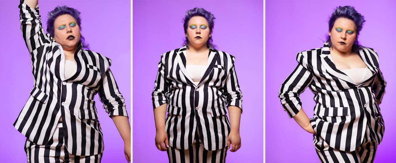 Photographic triptych showing a performer from the thigh up, dressed in a black and white vertical striped suit. Their sleeves are pulled up to show their forearms. In all the images they have their eyes closed. In the image on the left their right arm is raised up above their head. In the image in the middle, they have their arms by their side. In the image on the right they have their hands on their hips with their weight shifted on one leg. In all the images their hair has a blue tint and their eyes are made up with blue and yellow make-up.Behind them, the background is a graduated purple tone.